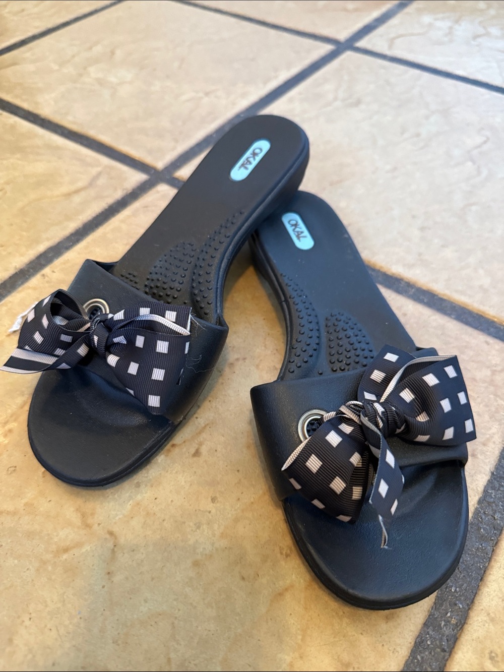 OKA b. Black Slide Sandals with Patterned Bow Accent